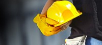 licensed contractor holding hardhat