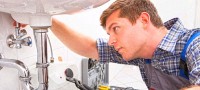 apprentice repairing sink