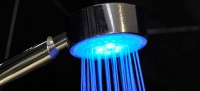 shower head with blue light coming out of it