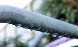 frozen ac pipe visible on the exterior of a toronto home