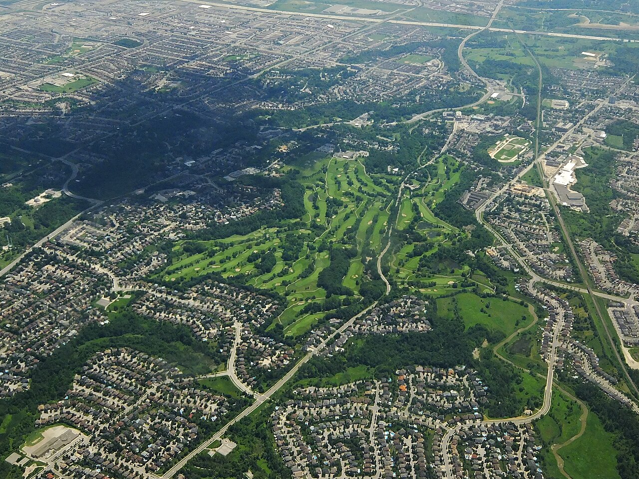 Shot from my seat on a Vancouver-Toronto flight in descent over Toronto. Looking south over the Country Club golf course, previously known as the Board of Trade Golf Course, in Woodbridge, Ontario.